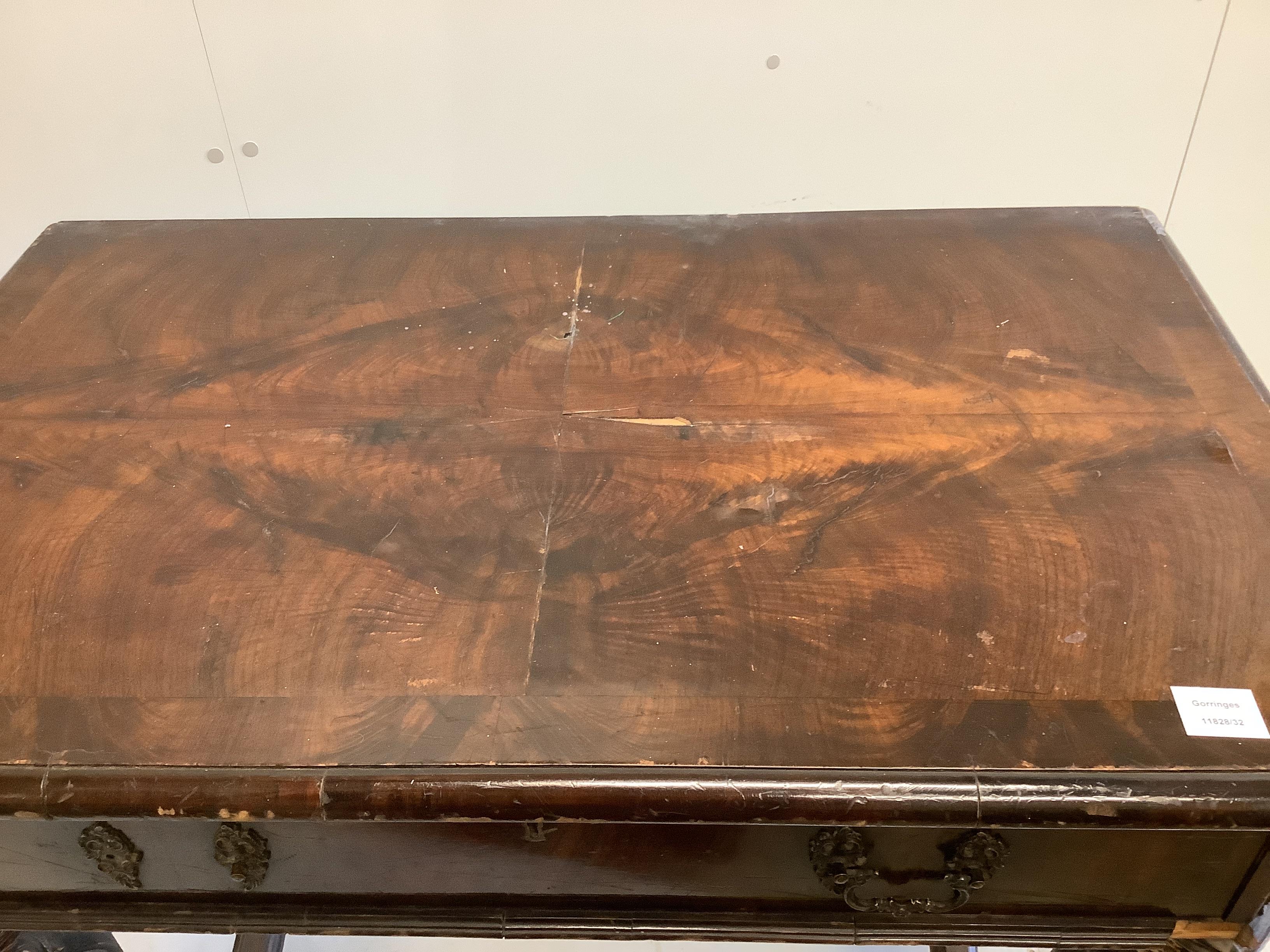 A Dutch parcel gilt banded walnut console table, fitted one long drawer, with mask and leaf carved legs, width 100cm, depth 61cm, height 89cm